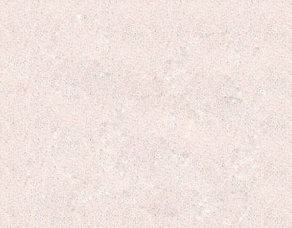 Close-up of a textured light beige surface with a speckled pattern, resembling fine sand or a concrete finish with small aggregates distributed throughout.