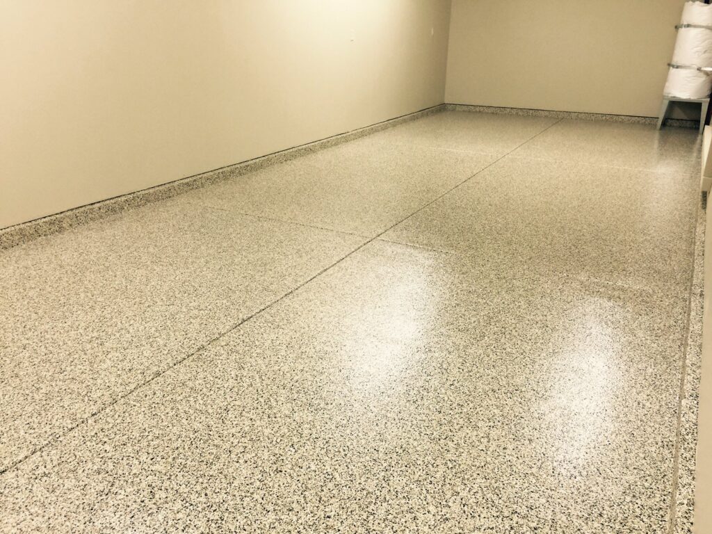 Sand Colored Epoxy Garage Slabs With Small Flakes