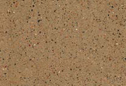 Close-up texture of a speckled tan surface, possibly a material like paper, fabric, or a fine-grained sandstone, with small flecks of red, white, and black distributed throughout.