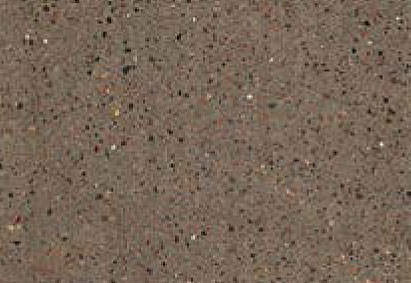 Close-up view of a granular gray surface with a fine distribution of black, white, and occasional colored specks.