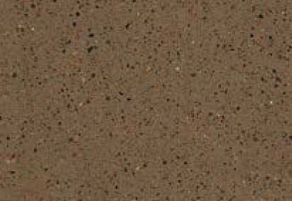Close-up view of a granular gray surface with a fine distribution of black, white, and occasional colored specks.