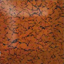 Close-up of a terracotta-colored surface with a cracked texture pattern throughout.