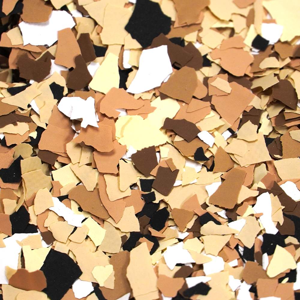 Multicolored confetti pieces in shades of brown, beige, and black, randomly scattered and overlapping, creating a diverse mosaic of colors and shapes.